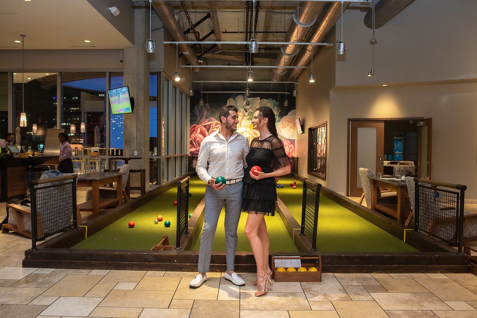 couple playing bocce ball at pinstripes upper kirby